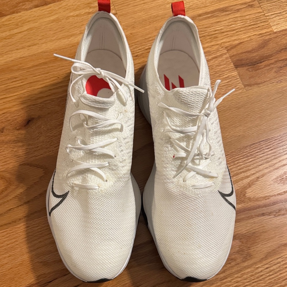 White Nike Zoom Athletic Sneakers with Red Accents
